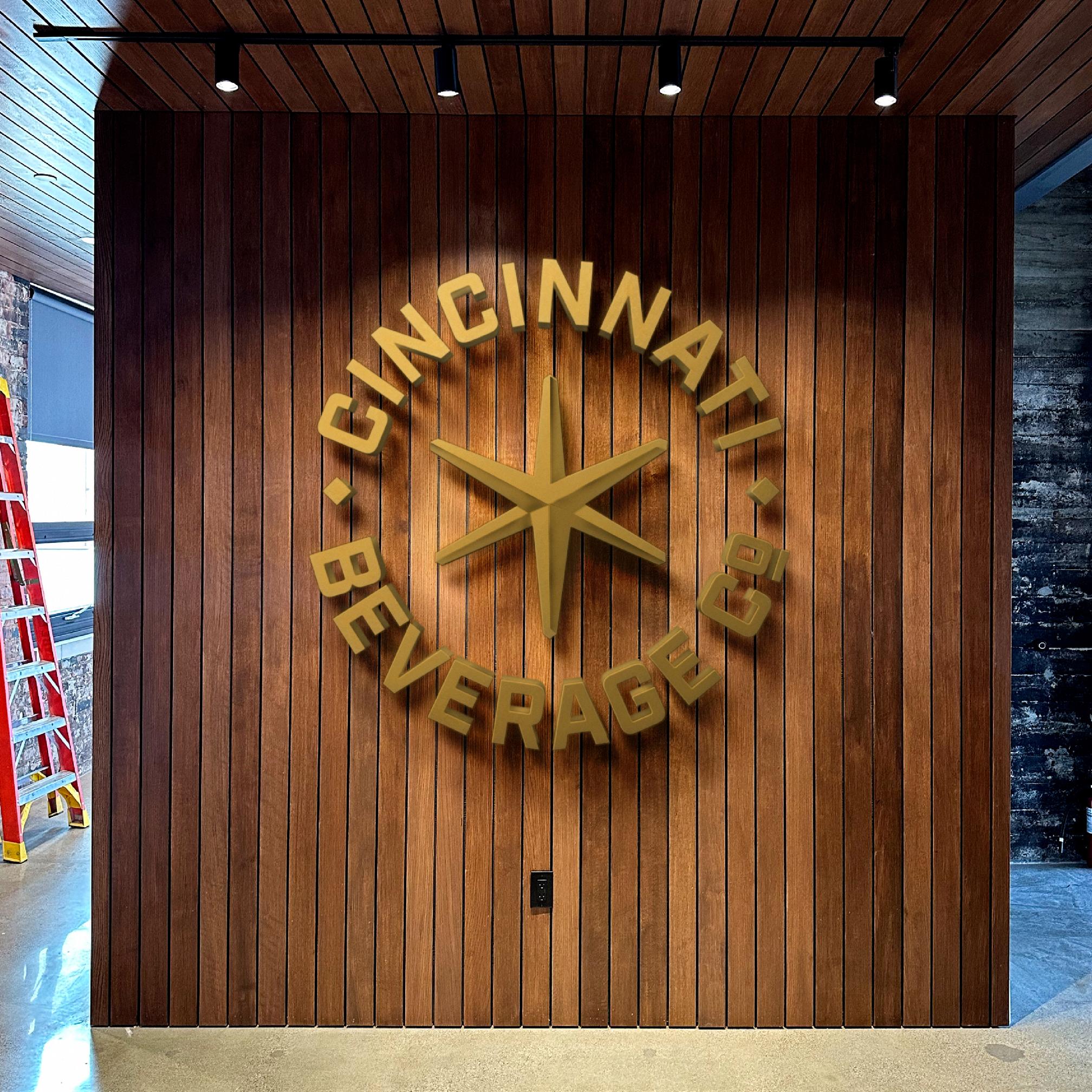 mockup of cincinnati beverage company entrance with logo cincinnati beverage company on the wall